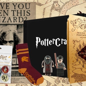May include: A Harry Potter themed gift set featuring a black notebook with the text "PotterCra" in white, a set of Gryffindor socks with a lion logo, a pack of Harry Potter badges, two Lego minifigures of Harry Potter and Rubeus Hagrid, and a Marauder's Map bookmark.
