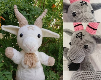 May include: Crochet pattern for a goat amigurumi doll. The pattern includes instructions for making a white goat with brown horns and a gray goat with pink horns. *Not a finished doll/object*