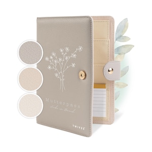 Könnte beinhalten: Ein Set aus drei Keramikbechern mit gesprenkelter, matter Oberfläche. Die Becher sind in Creme-, Hellgrau- und Dunkelgrautönen gehalten. Jeder Becher hat ein schlichtes, minimalistisches Design.