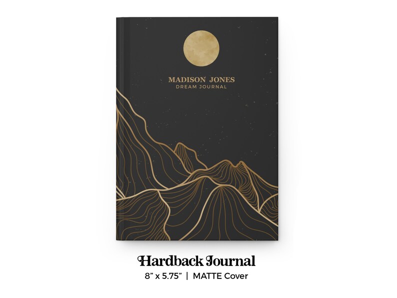 May include: Black hardback journal with a gold mountain range design and a full moon. The text "MADISON JONES DREAM JOURNAL" is printed on the front cover. The journal measures 8 inches by 5.75 inches.