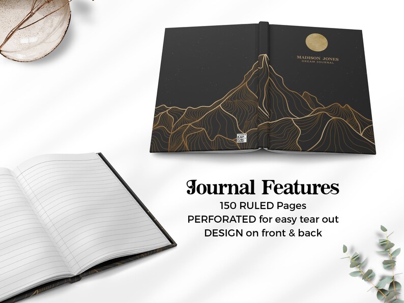 May include: Black journal with a gold mountain design on the front and back covers. The journal has 150 ruled pages and is perforated for easy tear out.