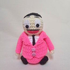John Waters inspired crochet art doll....the 'Pope Of Trash' himself, dressed in a pink suit.... what else!...
