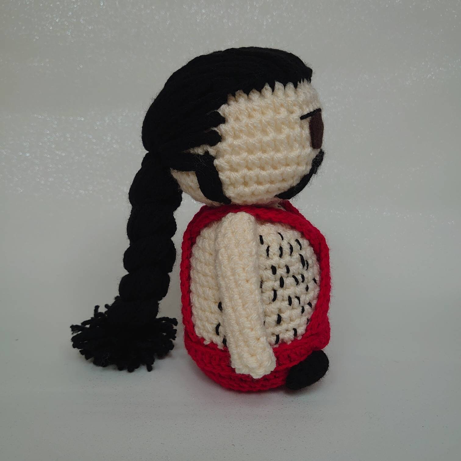 Sean Connery inspired crochet doll dressed in his iconic blue romper