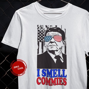 Ik ruik Commies patriottische Ronald Reagan politieke opinie citaat Amerikaanse vlag korte mouwen Unisex T-shirt