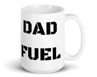 May include: White ceramic mug with black text that reads "DAD FUEL".