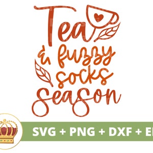 May include: Orange text on a white background reads "Tea & fuzzy socks season". A small orange cup with a heart inside is above the word "Tea".