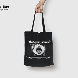 May include: Black tote bag with a white graphic of a woman's face with the text "bite me" in white letters.