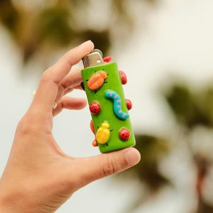 Neon Bug Lighter Case | Handmade Polymer Clay Charm Lighter Case Unique Accessory 3D Colorful Cute Trendy Lion King Grub Bugs Life