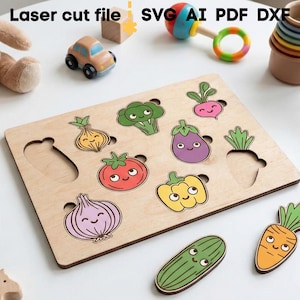 May include: Wooden vegetable puzzle with colourful, smiling vegetable pieces. The puzzle includes a tomato, onion, broccoli, aubergine, carrot, and more. The text "Laser cut file SVG AI PDF DXF" is in the top left corner. Other toys are scattered around the puzzle.
