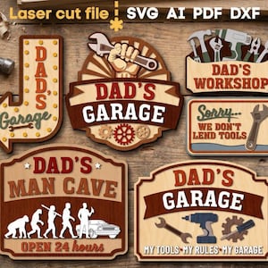 Puede incluir: Una colección de letreros de madera cortados con láser con temática de taller. Los letreros incluyen "Dad's Garage", "Dad's Workshop" y "Dad's Man Cave". Los letreros presentan herramientas, engranajes y el texto "Sorry We Don't Lend Tools".