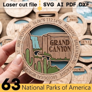 May include: Wooden laser-cut ornament featuring a Grand Canyon design with the text "Grand Canyon" and coordinates. The ornament is part of a set of 63 National Parks of America. The text "Laser cut file SVG AI PDF DXF" is at the top.