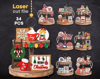 May include: A set of 34 laser cut wooden tiered tray decor pieces for different holidays and themes. The pieces include a Christmas wreath, a snowman, a coffee mug, a Christmas tree, a gingerbread house, a pumpkin, a ghost, a witch, a spider, a bat, a star, a bell, a candy cane, a stocking, a snowflake, a heart, a banner, a sign, and more. The pieces are all painted in bright colors and have a rustic, farmhouse style.