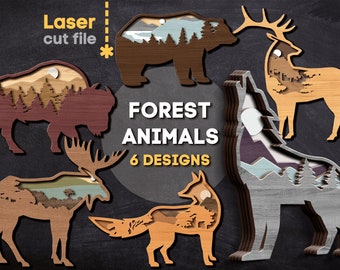 May include: Six laser cut wood designs of forest animals, including a bear, elk, wolf, moose, bison, and fox. Each animal has a layered design with a forest scene inside.
