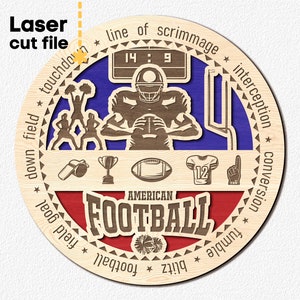 May include: A laser cut wooden design of an American football player with a scoreboard reading 14:9. The design includes various football-related terms like 'touchdown', 'blitz', 'field goal', 'interception', and 'conversion'.
