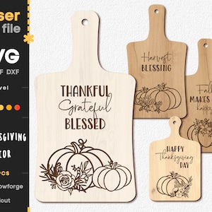 May include: Thanksgiving-themed laser cut file featuring four wooden cutting boards. Each board has a handle and is engraved with phrases like "Thankful, Grateful, Blessed" and pumpkin designs. The SVG file is compatible with Glowforge and Cricut.