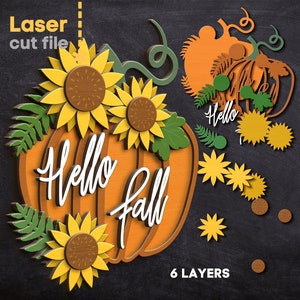 May include: A layered paper craft design featuring a pumpkin with the text "Hello Fall" and sunflowers. The design is on a black background and has 6 layers.