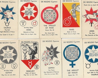 May include: A set of 16 vintage cards featuring astrological symbols and information. Each card has a different zodiac sign, including Taurus, Aries, Gemini, Cancer, Leo, and more. The cards are printed on white paper with red, blue, and yellow accents.