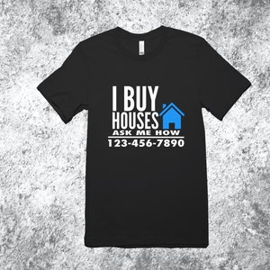 May include: Black t-shirt with white text that reads "I Buy Houses Ask Me How 123-456-7890". A blue house icon is next to the text.
