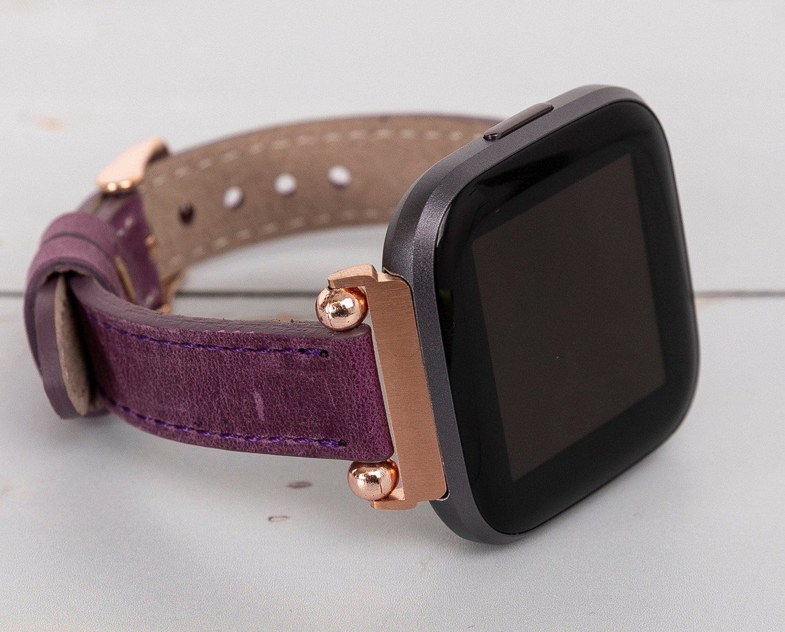 versa 2 emerald
