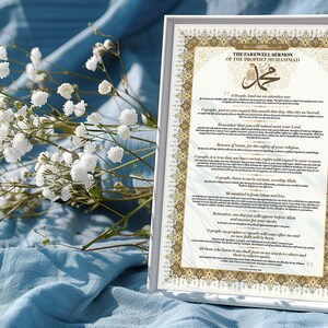 May include: A white framed print with a gold border and the text "The Farewell Sermon of the Prophet Muhammad" in a decorative font. The text is in Arabic and English.