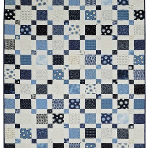 May include: A patchwork quilt in shades of blue, white, and black. The quilt features a grid pattern of squares in various sizes and patterns, including polka dots, floral designs, and solid colors. The overall design is symmetrical and visually appealing.