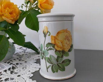French Paris porcelain apothecary jar in white color with yellow Rose decor and vintage lid from the 60s/70s stamped