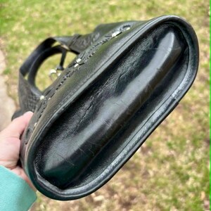 May include: A set of three ceramic mugs with a speckled, matte finish. The mugs are in shades of cream, light gray, and dark gray. Each mug has a simple, minimalist design and a rounded handle.