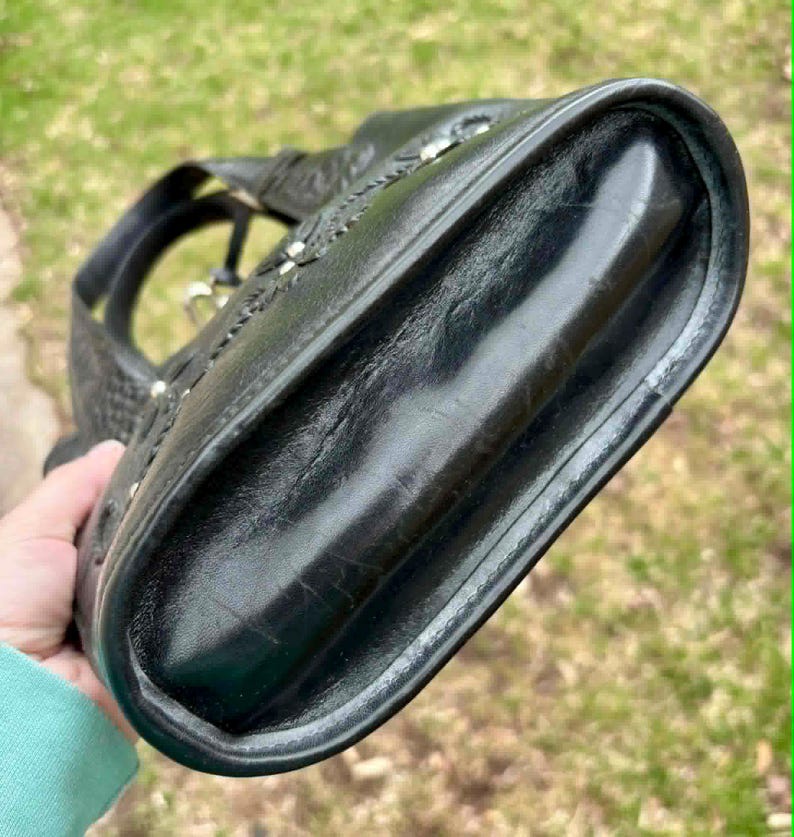 May include: A set of three ceramic mugs with a speckled, matte finish. The mugs are in shades of cream, light gray, and dark gray. Each mug has a simple, minimalist design and a rounded handle.