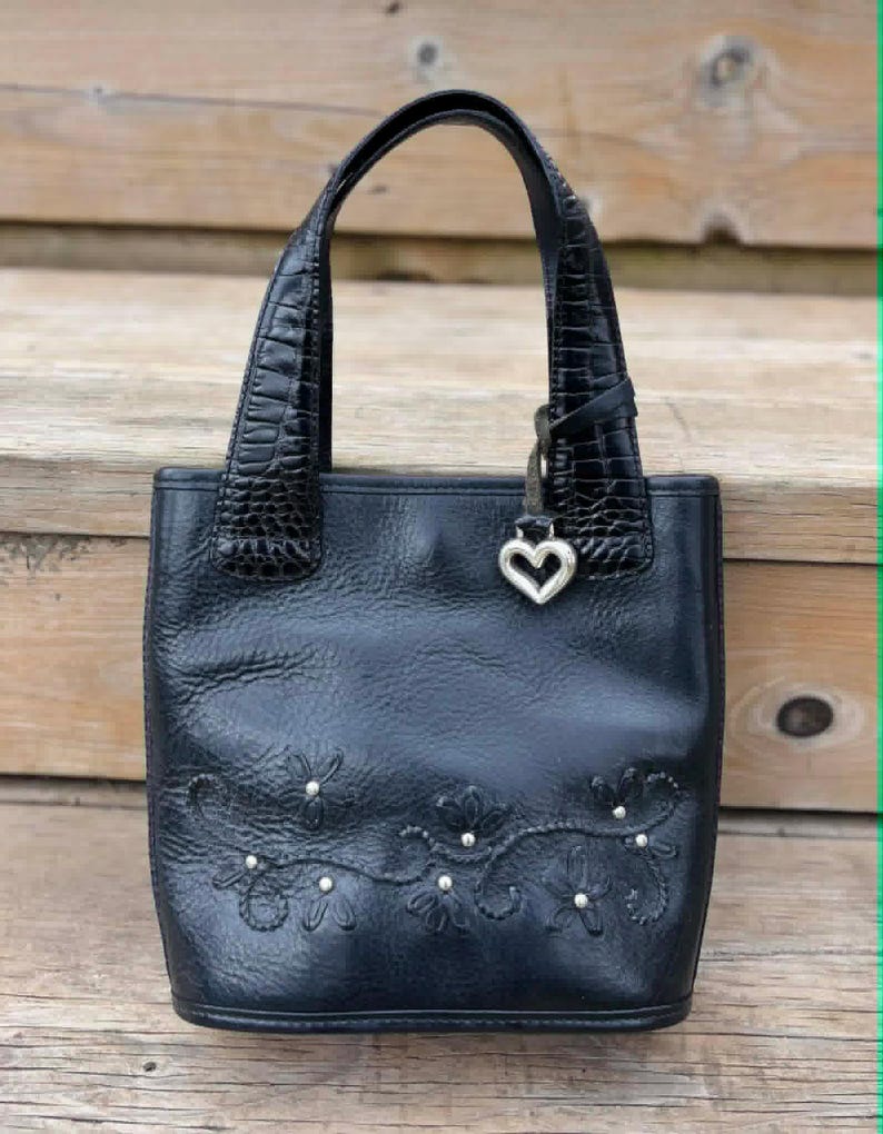 May include: A rustic wooden sign with the text "Welcome to our home" in white lettering. The sign features a distressed finish and a simple, inviting design, perfect for entryway decor.