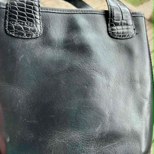 May include: A set of three ceramic mugs with a speckled, matte finish. The mugs are in shades of cream, light gray, and dark gray. Each mug has a simple, minimalist design, perfect for coffee or tea.