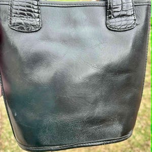 May include: A set of three ceramic mugs with a speckled, matte finish. The mugs are in shades of cream, light gray, and dark gray. Each mug has a simple, minimalist design and a rounded handle. Perfect for coffee or tea.