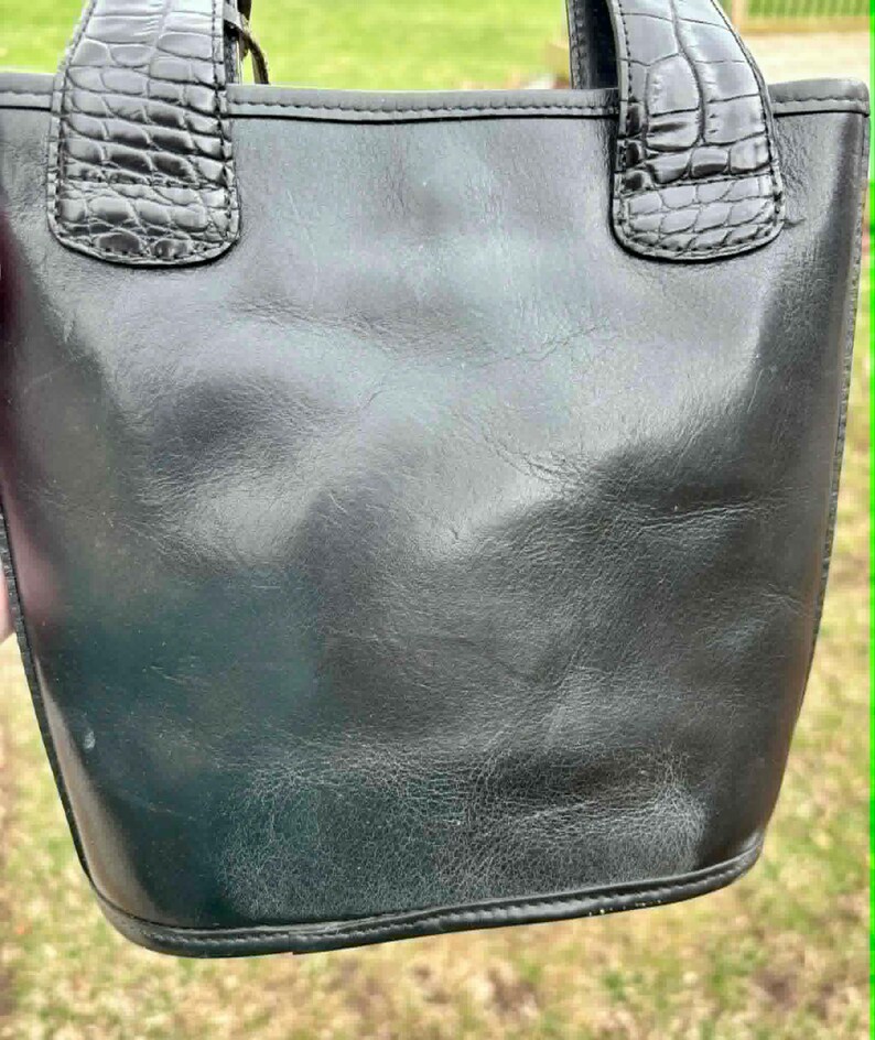 May include: A set of three ceramic mugs with a speckled, matte finish. The mugs are in shades of cream, light gray, and dark gray. Each mug has a simple, minimalist design and a rounded handle. Perfect for coffee or tea.