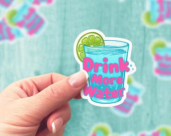 May include: A sticker with a blue glass of water with a lime wedge and the text "Drink More Water" in pink letters.