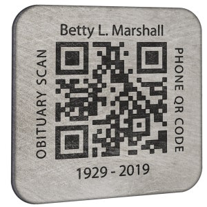 May include: A silver metal memorial plaque with a black and white QR code, the text "Obituary Scan" on the left, "Phone QR Code" on the right, "Betty L. Marshall" at the top, and "1929 - 2019" at the bottom.