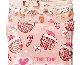 May include: A set of five pink and white poly mailers with a festive Christmas design. The mailers feature a repeating pattern of disco balls, candy canes, stars, and flowers. The text "'Tis the Season" is printed in pink on the front of the mailers.