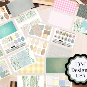 May include: A collection of assorted craft paper sheets and die-cut ephemera featuring floral patterns, gingham checks, stripes, and bird illustrations. The set includes various tags, labels, and text strips with words like RESPECT, FEARLESS, BELIEVE, JOURNEY, HUMBLE, and BLESSED, alongside a logo reading DM Designs USA.