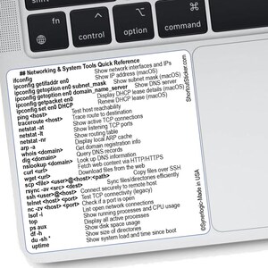 May include: A white sticker with black text, listing networking and system tools quick reference commands for macOS. The sticker is on a laptop keyboard, with the "control", "option", and "command" keys visible.
