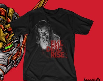 May include: Black t-shirt with a graphic of a zombie from the Evil Dead Rise movie. The text "Evil Dead Rise" is printed in red on the shirt.