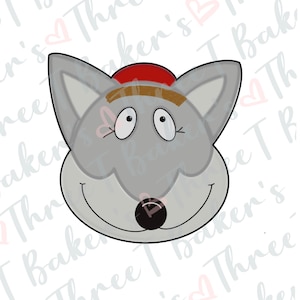 Puede incluir: Un cortador de galletas de lobo gris con un sombrero rojo y cejas marrones. El lobo tiene ojos grandes y una amplia sonrisa.