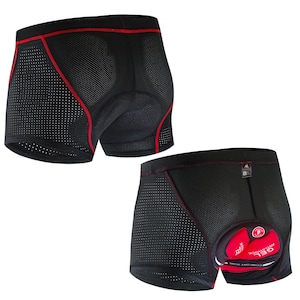 May include: Black cycling shorts with red trim and a padded seat. The shorts are made of a breathable mesh fabric with small holes.