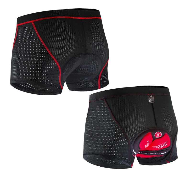 May include: Black cycling shorts with red trim and a padded seat. The shorts are made of a breathable mesh fabric with small holes.