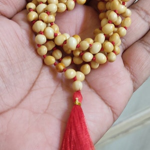 White chirmi gunja mala for goddess laxmi good fortune wealth
