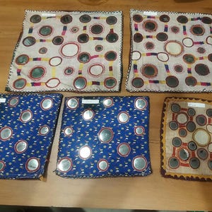 May include: A set of three ceramic mugs with a speckled, matte finish in cream, light grey, and dark grey. Each mug has a simple, minimalist design, ideal for tea or coffee.