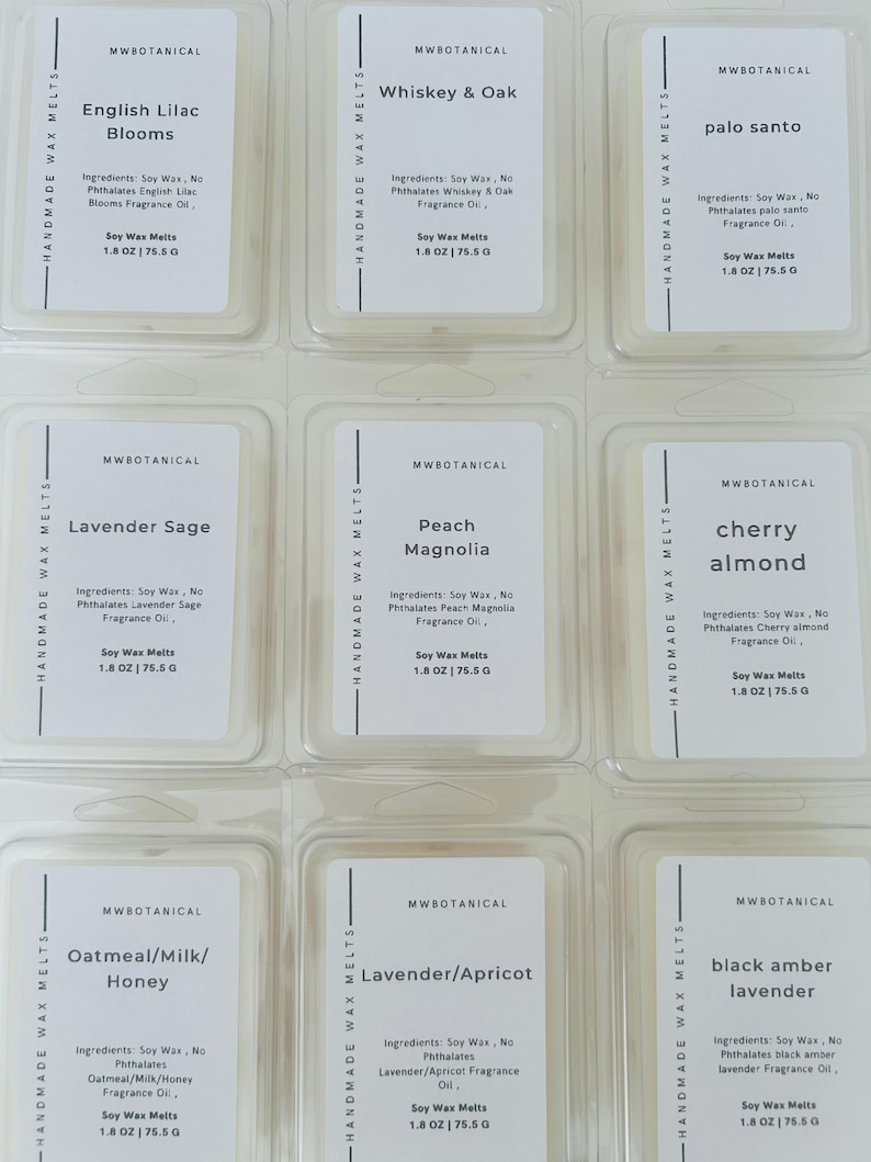 May include: Nine rectangular clear plastic containers of MWBOTANICAL handmade soy wax melts arranged in a grid. Each label lists the scent, ingredients, and a weight of 1.8 oz | 75.5 g. Scents include English Lilac Blooms, Whiskey & Oak, and Palo Santo.