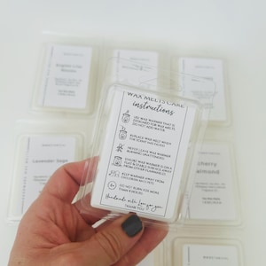 May include: A clear plastic clamshell package containing wax melts with a white instructional label. The label features text titled WAX MELTS CARE INSTRUCTIONS, including safety icons and warnings about wax warmer use, plus a thank you note.
