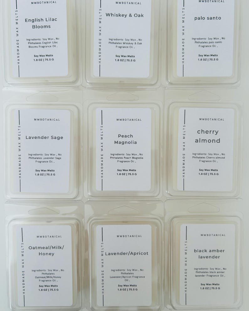 May include: Nine clear plastic clamshell containers of MWBotanical soy wax melts arranged in a grid. Each label lists ingredients, fragrance names like English Lilac Blooms and Whiskey & Oak, and a net weight of 1.8 oz | 75.5 g per unit.