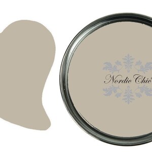 May include: A can of light beige paint labeled "CLAY" by Nordic Chic.