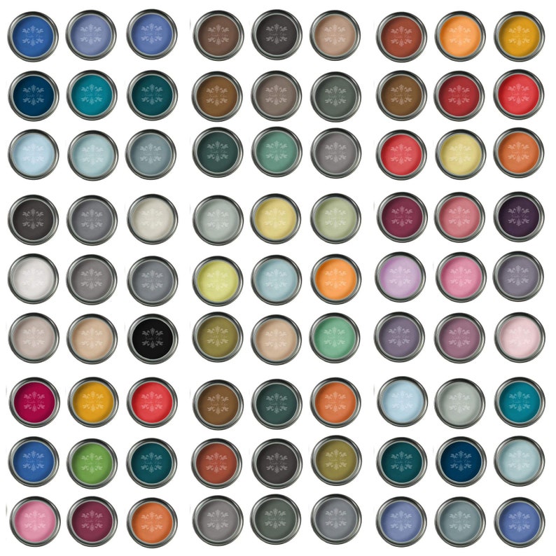 May include: A collection of 64 paint samples in various colors, displayed in small round metal containers. Each container has a snowflake design on the lid.