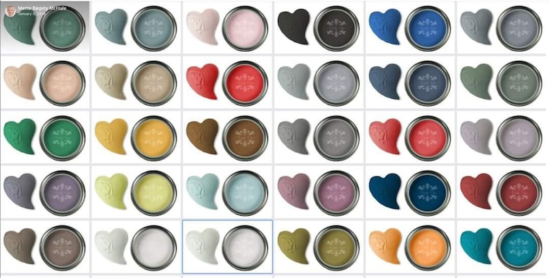 May include: A grid of 48 paint samples in small round containers. Each container has a heart-shaped sample of the same color paint. The colors range from light to dark, including shades of green, blue, red, brown, gray, and white.