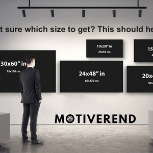 May include: An image showing a man in a suit standing in front of a wall with several black rectangular canvases of varying sizes. The canvases are labeled with their dimensions in inches and centimeters, including 30x60" (75x150 cm). The text "Not sure which size to get? This should help." is at the top.